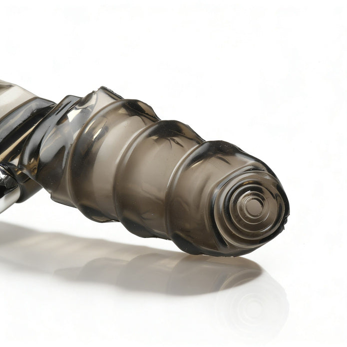 Detailed close-up of the textured stimulator tip and raised spiral ridges on the smoke-colored vibrating finger glove.