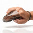 Vibrating finger glove worn on a finger, showcasing the ergonomic fit, textured stimulation sleeve, and secure finger loop.