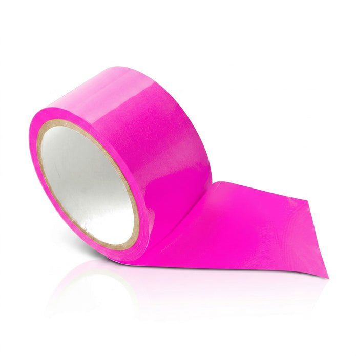 Close-up of a roll of pink bondage tape partially unrolled, highlighting the smooth glossy finish and flexible self-adhering material.