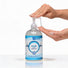 Hand dispensing CleanStream Ease Hybrid Anal Lubricant from a 16.4 oz pump bottle, demonstrating the smooth texture and easy-to-use pump design.