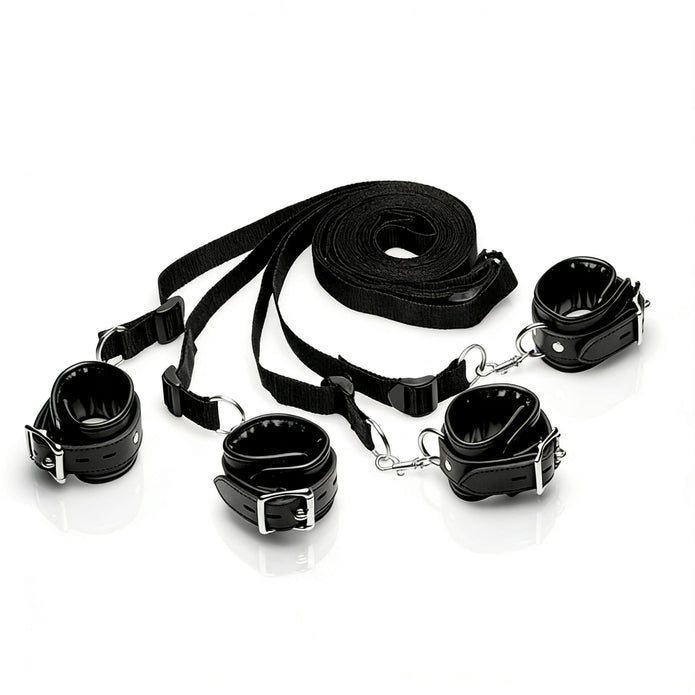 Deluxe bed restraint kit shown assembled with padded cuffs, adjustable nylon straps, metal clips, and attachment points for versatile restraint configurations