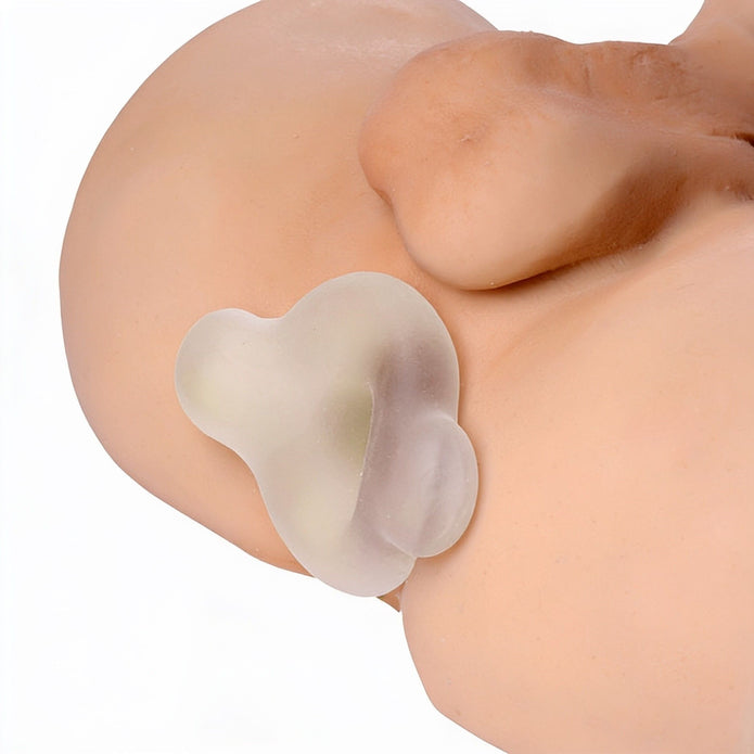 Side profile of the Inception Multi-Functional Sex Sleeve positioned on an anatomical model, highlighting its contoured shape and flexible construction.