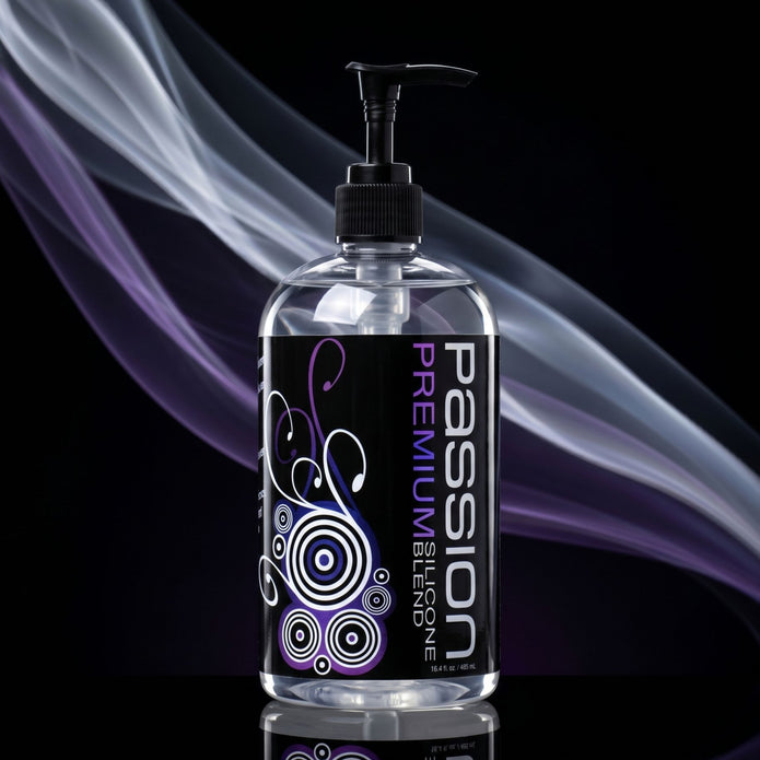 Clear pump bottle of Passion Premium Silicone-Based Lubricant featuring a black label with purple accents and decorative swirl graphics on a dark background