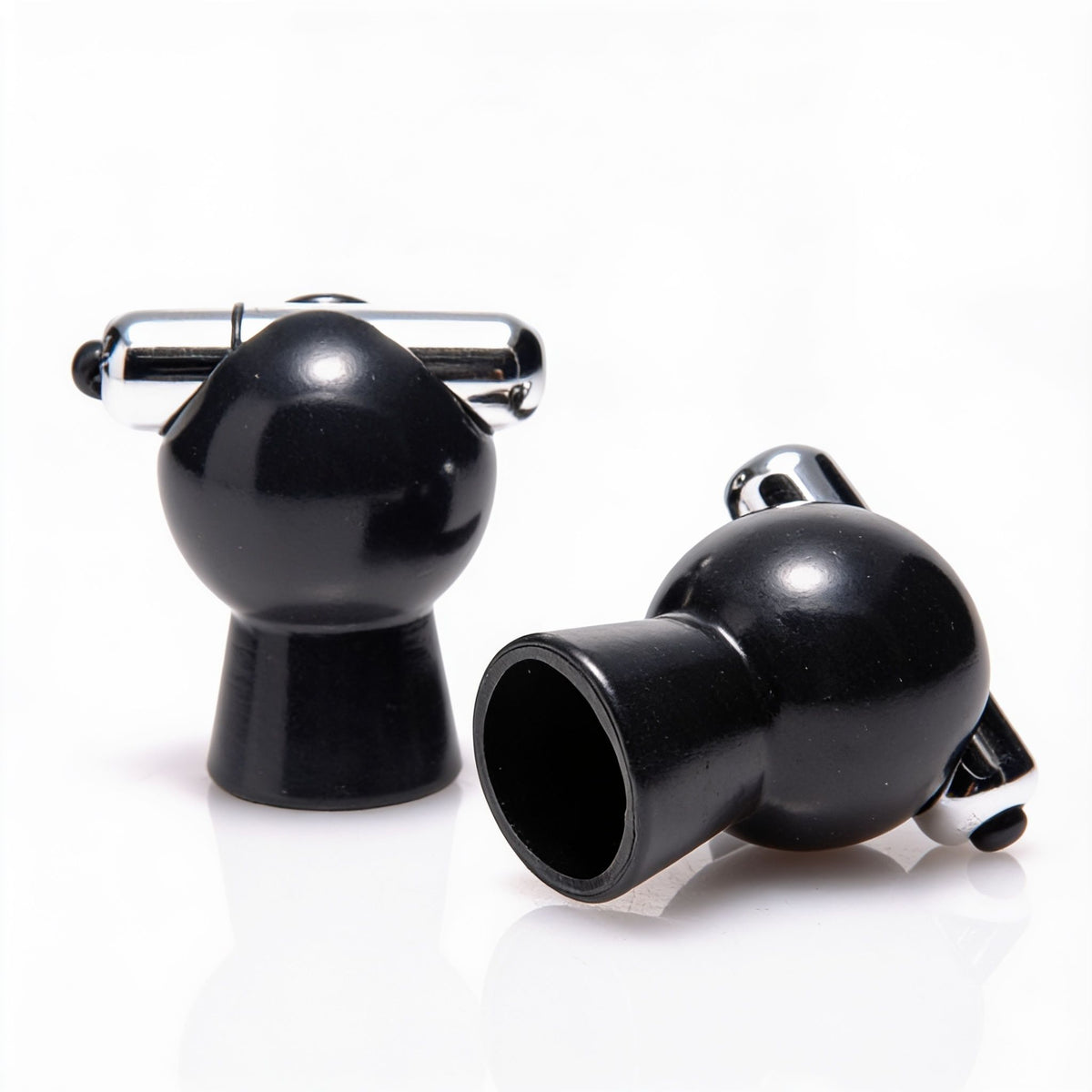 Pair of black vibrating nipple suckers with chrome bullet vibrators, shown from multiple angles to highlight the suction cups and compact design.