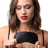 Female model holding a black satin blindfold, highlighting the lightweight construction, soft satin fabric, and comfortable fit