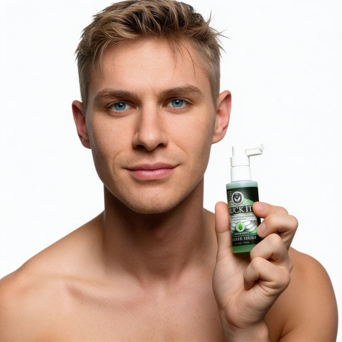 Male model holding Suck It Deep Throat Desensitizing Oral Spray bottle to demonstrate product size and packaging