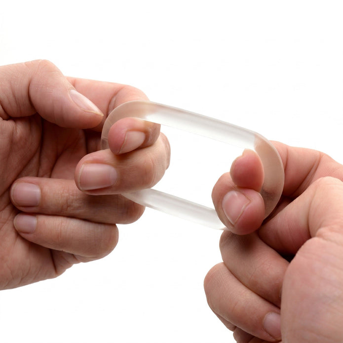Hands stretching the Super Stretch Universal Cock Ring to demonstrate its highly elastic material, durability, and adaptable fit.