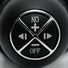 Macro image of the Violator 13 Mode XL Dildo Thruster control interface showing power, intensity adjustment, and mode selection buttons integrated into the handle.
