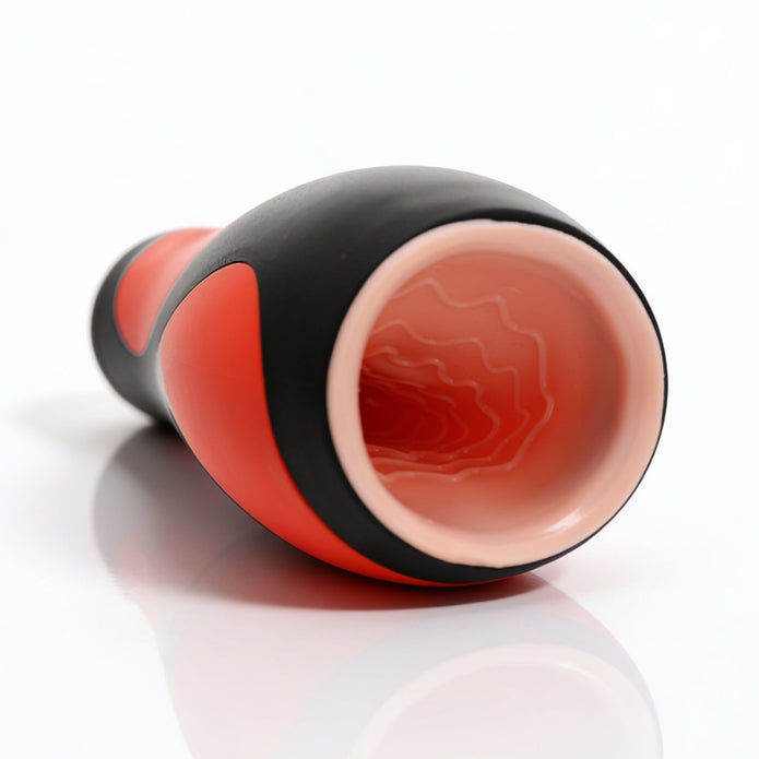 Close-up view of the Vibra Head Bionic Auto Stroker opening showing the soft internal sleeve with textured canal designed for varied stimulation.
